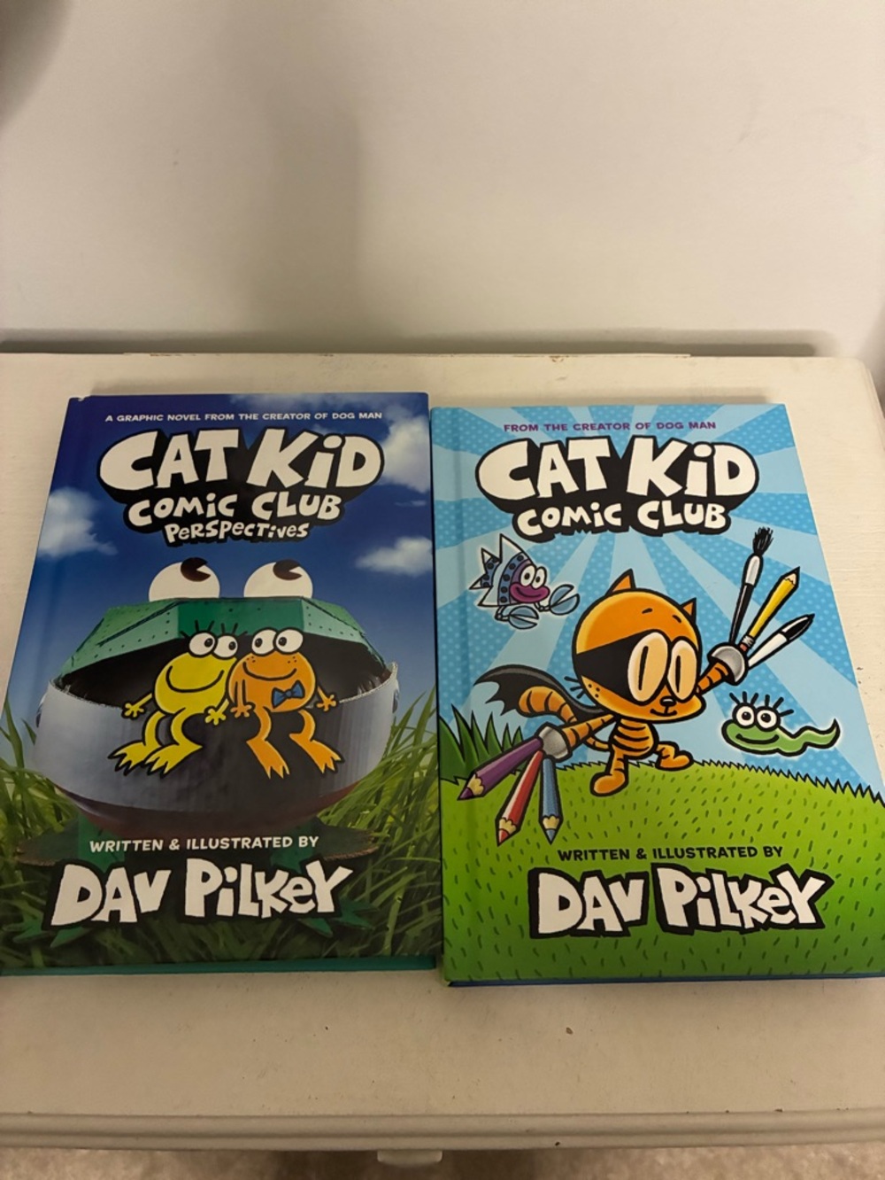 2 brand new Cat Kid Comic Club Graphic Novels by Dav Pilkey. You get both